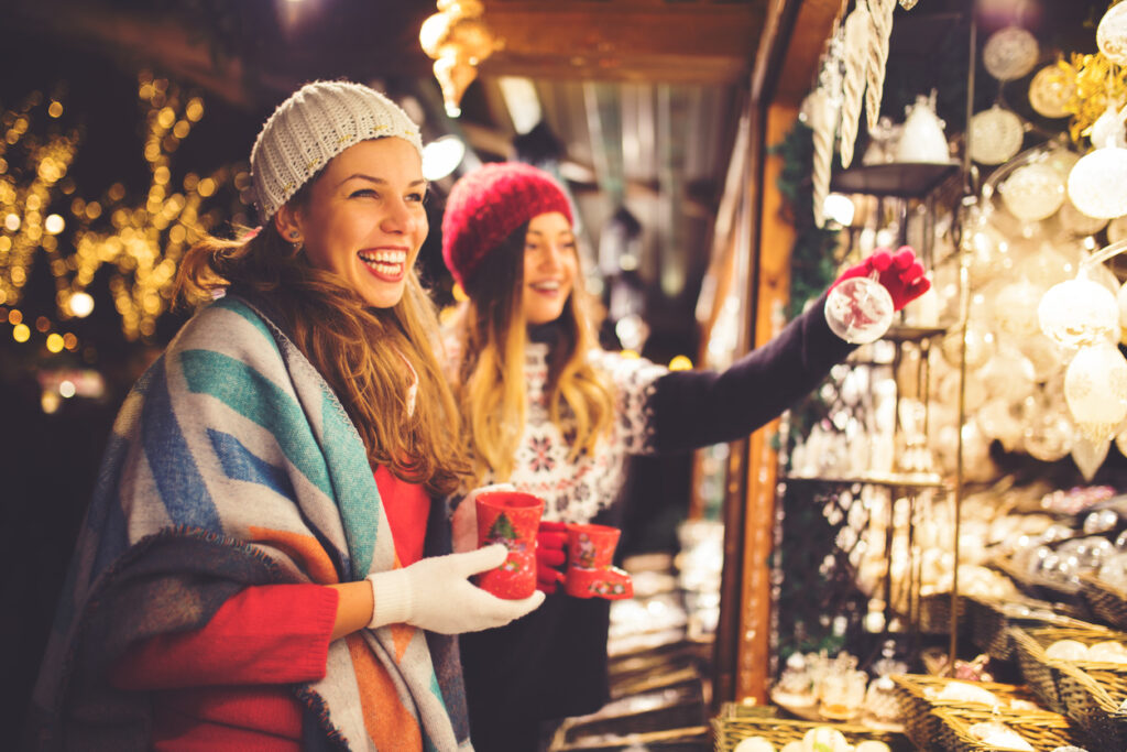 Women enjoying a Christmas Market booth