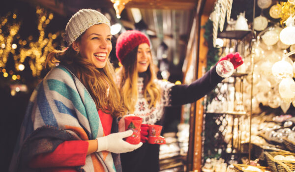 Women enjoying a Christmas Market booth