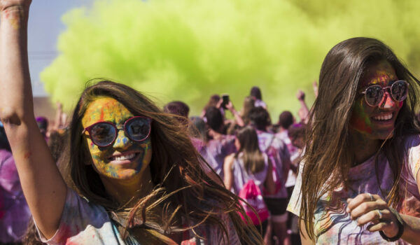 Smiling Women at a Holi Event